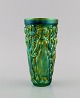 Zsolnay vase in glazed ceramics modeled with women picking grapes. Beautiful 
metallic luster glaze. Mid-20th century.

