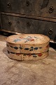 Swedish 1800 century oval wooden box with original paint 
with floral motif.
H:20cm. L&W:42x26cm.