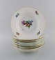 Royal Copenhagen Saxon Flower. Seven deep plates in hand-painted porcelain with 
flowers and gold decoration. Model number 493/1615. Early 20th century.
