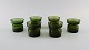 Jens Harald Quistgaard. Eight "Hygge" light holders for teacandles in dark green 
art glass. Retro, 1960