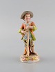 German porcelain figurine. Young gardener. 20th century.
