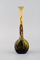 Rare antique Emile Gallé vase in yellow and dark art glass carved in the form of 
branches with foliage. Early 20th century.

