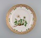 Royal Copenhagen Flora Danica lunch plate in hand-painted porcelain with flowers 
and gold decoration. Model number 20/3550.
