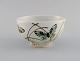 Nils Thorsson for Royal Copenhagen. Rare bowl in glazed faience decorated with 
butterflies. 1970s.
