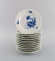 Twelve Royal Copenhagen Blue Flower Curved plates. Model number 10/1625.
