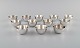 Elon Arenhill (1922-2018). Well-known Swedish silversmith. Twelve modernist cups in hammered sterling silver. Dated 1974.