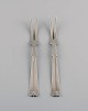 Hans Hansen silverware no. 7. Two art deco cold meat forks in silver (830). 
Dated 1936.
