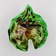 Leaf-shaped Murano bowl in polychrome mouth blown art glass. Green background. 
Italian design, 1960s.

