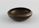 Carl Harry Ståhlane (1920-1990) for Rörstrand Atejle. Small bowl in glazed 
ceramics. Beautiful glaze in shades of brown. 1960s.
