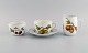 Royal Worcester, England. Evesham porcelain morning cup with sugar bowl and 
cream jug decorated with fruits and gold rim. 1980s.
