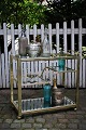 K&Co. presents: Old "brass" bar cart/trolley on wheels from the 1970s with clear glass plates with mirror glass ...