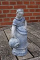 Hjorth Danish stoneware figurine in blue glaze. 
Girl with jar