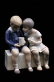 Bing & Grondahl porcelain figure of little boy and girl drinking milk.