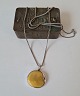 Karstens Antik presents: Long necklace in silver with large amber pendant