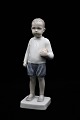 Bing & Grondahl porcelain figurine of a boy with a ball. 
B&G#1945...