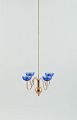 Gunnar Ander for Ystad Metall. Chandelier for four candles in brass and 
mouth-blown art glass shaped like flowers.