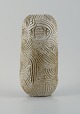 Christina Muff, dansk samtidskeramiker (f. 1971).
Unique, handcarved vase in stoneware clay. Covered in a shiny, semi transparent 
glaze with white flakes.