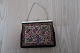 Vintage /retro:
Beautiful old handbag
Mit embroidery (but as far as we judge, not made 
by hand)
Beautiful closing item 
About 1950