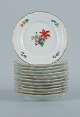 Royal Copenhagen, Light Saxon Flower.
Twelve plates of porcelain, decorated in colors and gold with flowers.