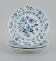 Meissen, a set of three Blue Onion dinner plates.