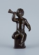 Just Andersen, sculpture in disco metal, naked boy blowing a horn.