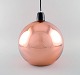 Tom Dixon (b. 1958), British designer. Round copper colored ceiling pendant. 
Clean design, 21st Century.
