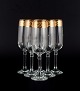 Italian design, six champagne glasses in clear art glass with gold rim.