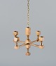 Gusum Metall, Sweden, chandelier in solid brass for four candles.
Swedish design.