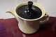 Teapot made of porcelain
Yellow with a black lid, and with black stripe
This teapot is a part of a service called 
Mandalay
Kronjyden, Randers, Denmark
Design: Henning jensen 1958, Denmark
Stamp: Kronjyden, Randers
About 22,5cm
