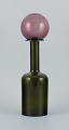 Otto Brauer for Holmegaard. Vase/bottle in green hand-blown art glass with 
purple ball.