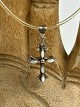 Vintage silver cross with transparent natural 
rubber "chain" and silver clasp.