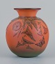 Ipsens, Denmark, vase with flowers and butterfly.
Glaze in orange and green tones.