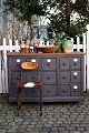 Old, 1800s grocery counter with a total of 15 drawers, some with old white 
porcelain signs...