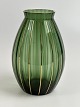 Rare glass vase in green and gold from the Danish glassworks Holmegaard. Moss 
green with optical stripes and gold stripes