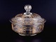 French Lidded bowl in mouth-blown glass with faceted motifs and gold decoration.
