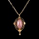 Georg Jensen; A 
necklace in 18k 
gold set with a 
rose quartz