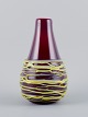 Murano, Italy, large mouth-blown spaghetti vase in burgundy art glass.