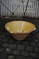 Large 19th century clay dish "Tian" from the South of France with yellow glaze 
pouring...
Dia.:55cm.