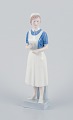 Royal Copenhagen, rare porcelain figurine of a nurse.