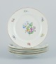 Bing & Grøndahl, Saxon Flower, a set of five dinner plates hand-decorated with 
polychrome flowers and gold rim.