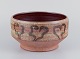 Mogens Nielsen, Nysted, Denmark, large handmade ceramic bowl decorated with 
abstract motifs. Glazed in brown tones.