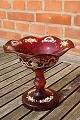 Bohemian glass. Ruby red centerpiece or candy bowl on high stand with nice decoration