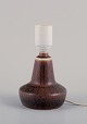 Gunnar Nylund for Rörstrand, small ceramic table lamp.
Glaze in brown tones.