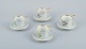 Bing & Grøndahl, a set of four antique coffee cups with high handles and  
saucers.