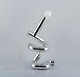 Gaetano Missaglia, Italian designer, Rombo table lamp composed of pipes in 
chrome-plated ABS plastic. Futuristic style.