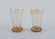 Emile Gallé (1846-1904), fransk kunstner og designer.
To små krystalglas hånddekoreret med blade i guld.