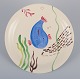 Stig Lindberg for Gustavsberg. "Löja" plate. Hand-painted with a fish motif. 
Satirical illustration with Swedish text.