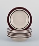 Raija Uosikkinen and Ulla Procopé for Arabia, Finland. A set of eight "Ruija" 
deep plates in stoneware with brown decoration.