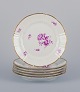 Bing & Grøndahl. Set of six luncheon plates with flower decorations in purple 
and gold trim. Hand-painted.