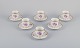 Bing & Grøndahl, Denmark. A set of six demitasse cups with saucers decorated 
with floral motifs in purple and gold trim. Hand-painted.